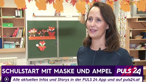 Schulstart mit Maske und Ampel